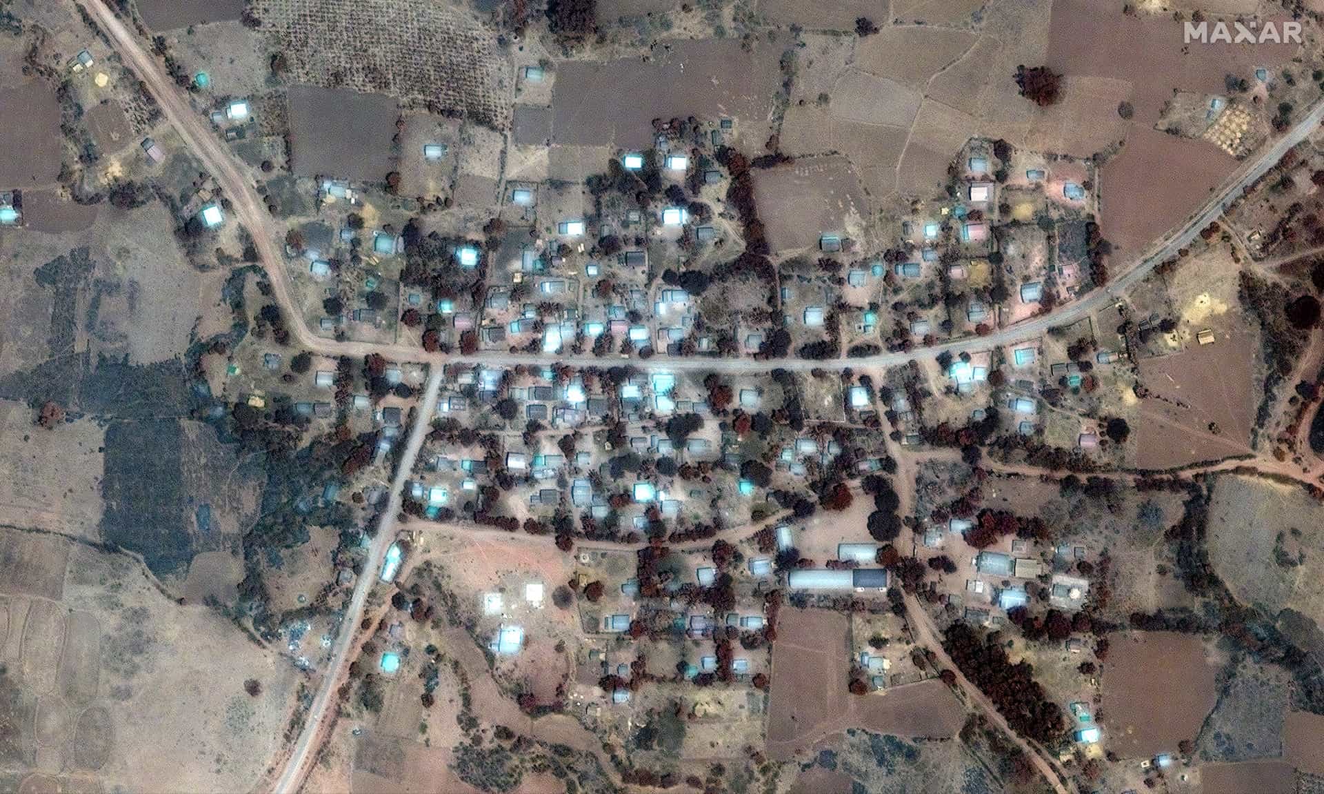 A image slider comparing two satellite images in Pa Zi Gyi village, before and after an airstrike.