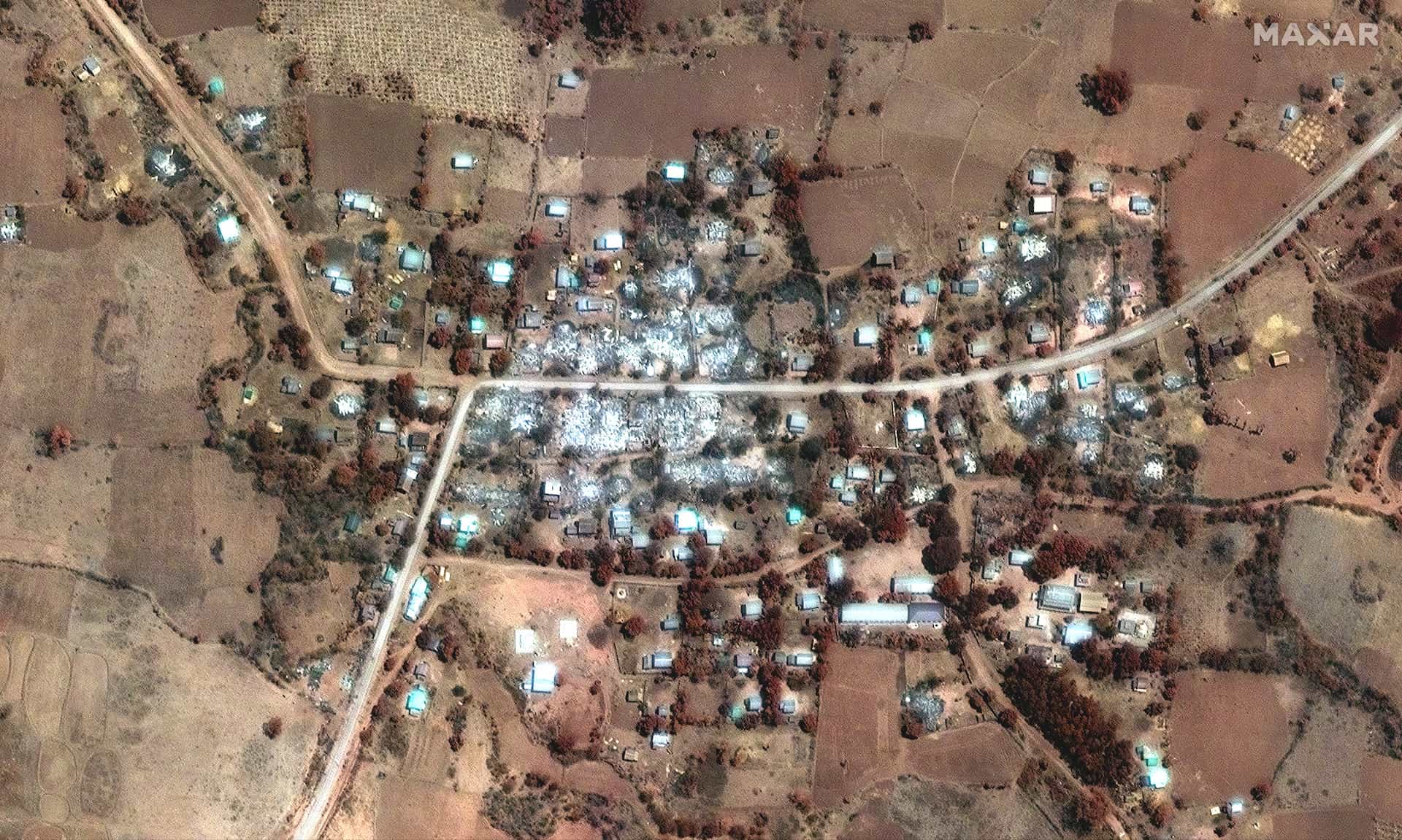 A image slider comparing two satellite images in Pa Zi Gyi village, before and after an airstrike.